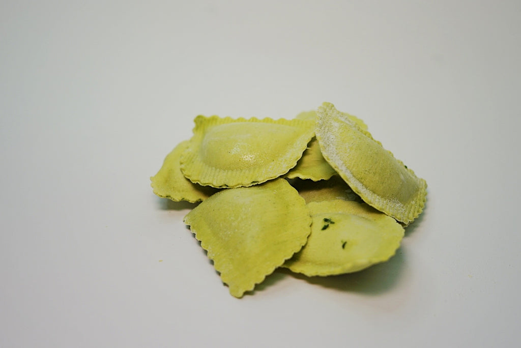 Mezzelune de Espinacas y Pecorino